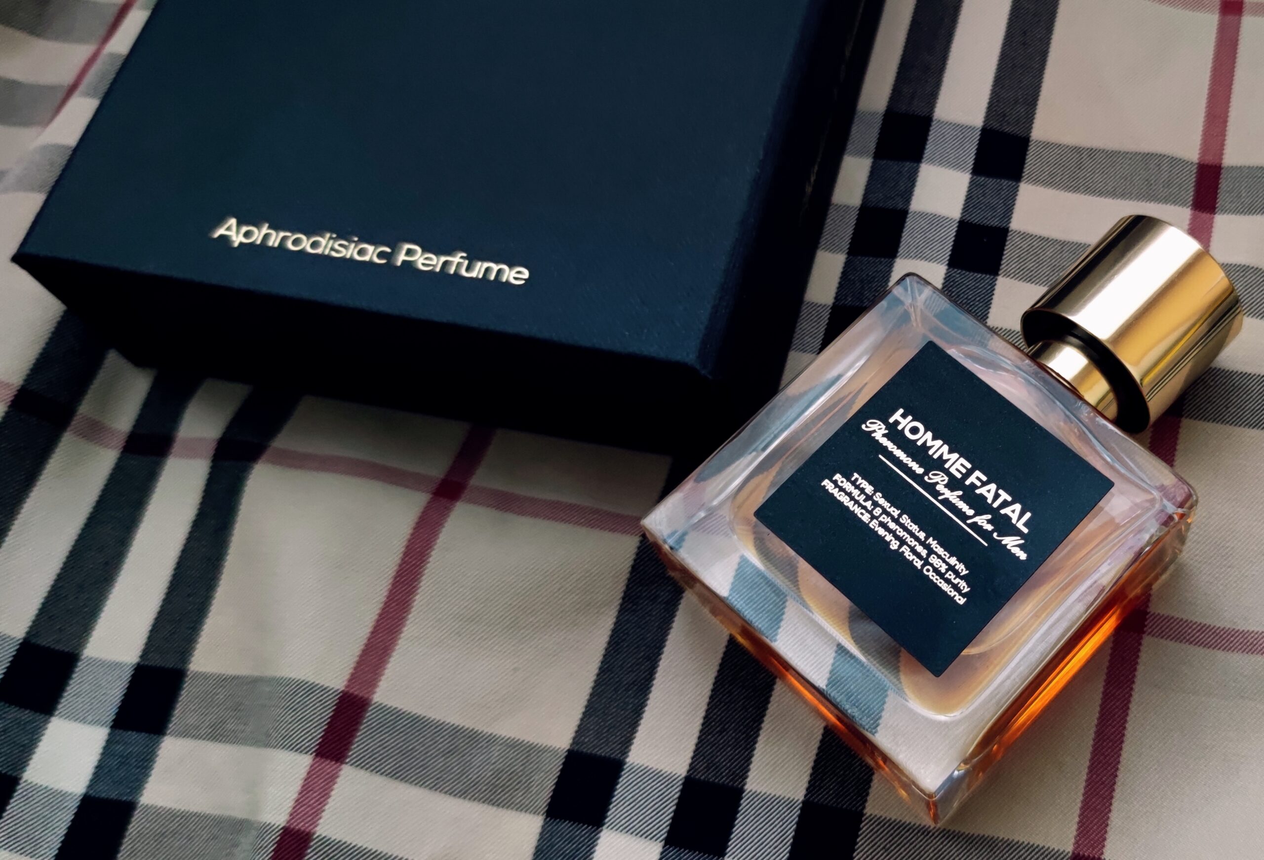 Sleek-glass-bottle-of-Homme-Fatal-pheromone-cologne-with-magnetic-box-packaging-scaled